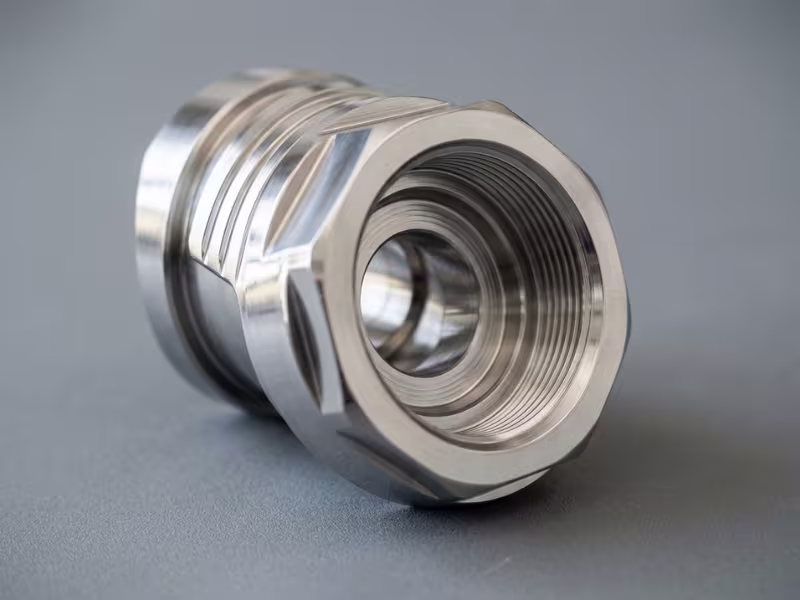 Close up of polished stainless steel machined part