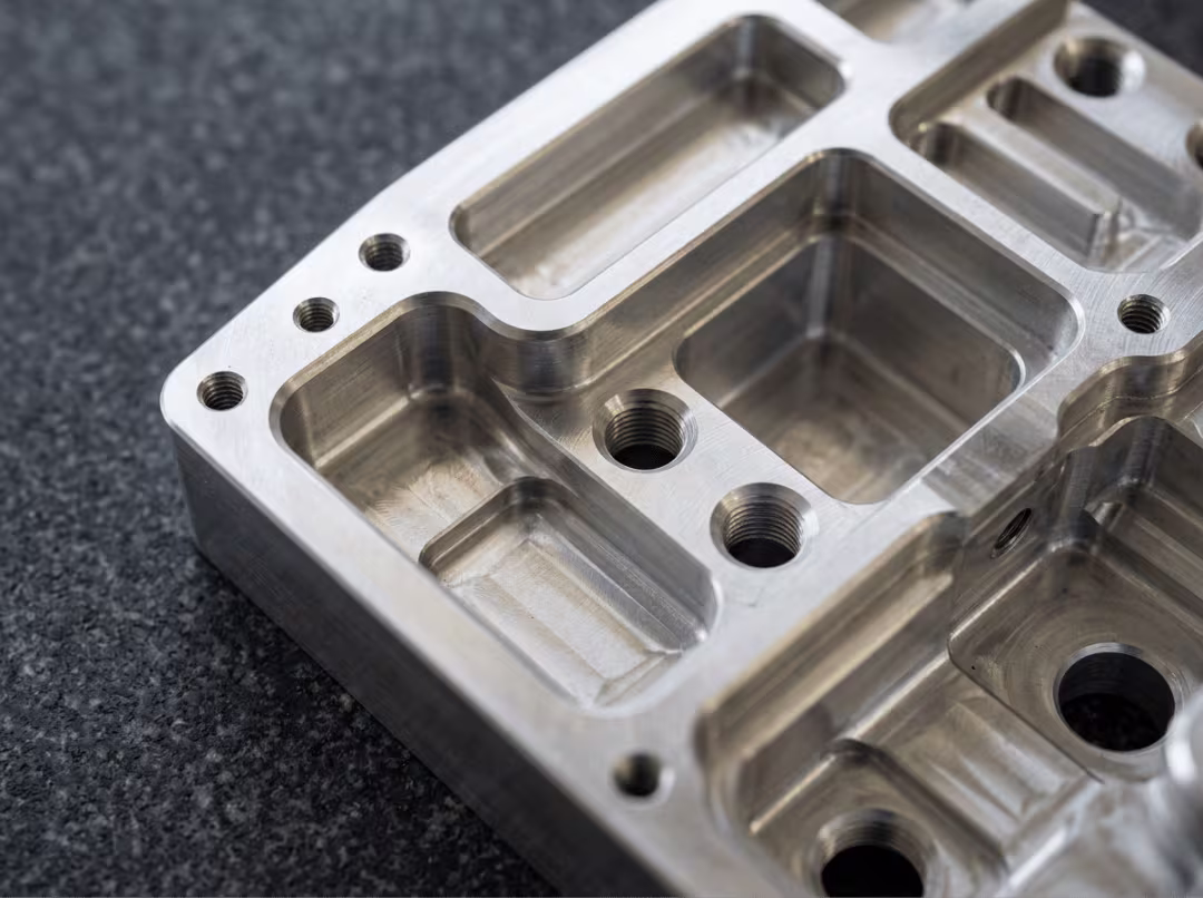 Machined aluminum part with rounded internal corners and pockets Machined aluminum part with rounded internal corners and pockets