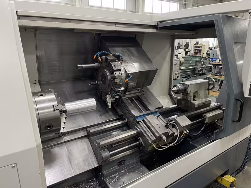 Chuck, turret, and tailstock inside a CNC lathe Chuck, turret, and tailstock inside a CNC lathe